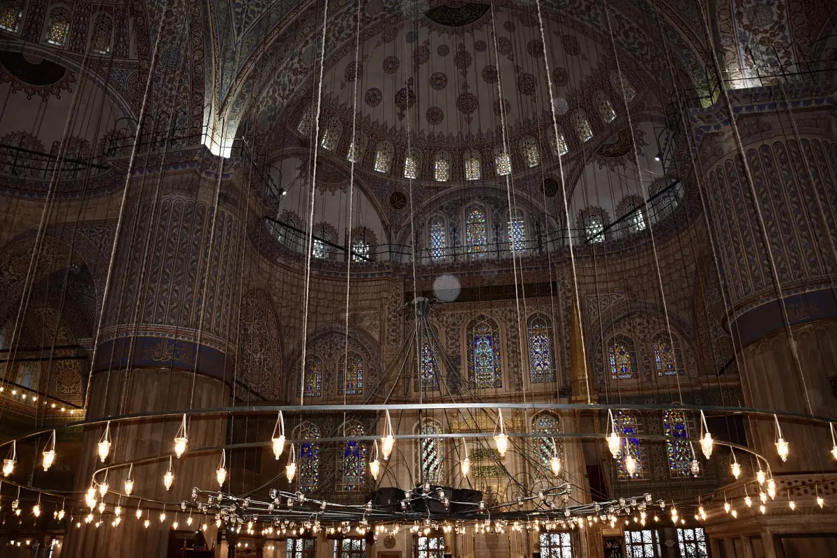 Prayer hall with hanging lamps under the domes